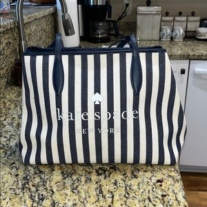 Like new Authentic Kate Spade Street Tote Handbag. Denim stripe navy blue.